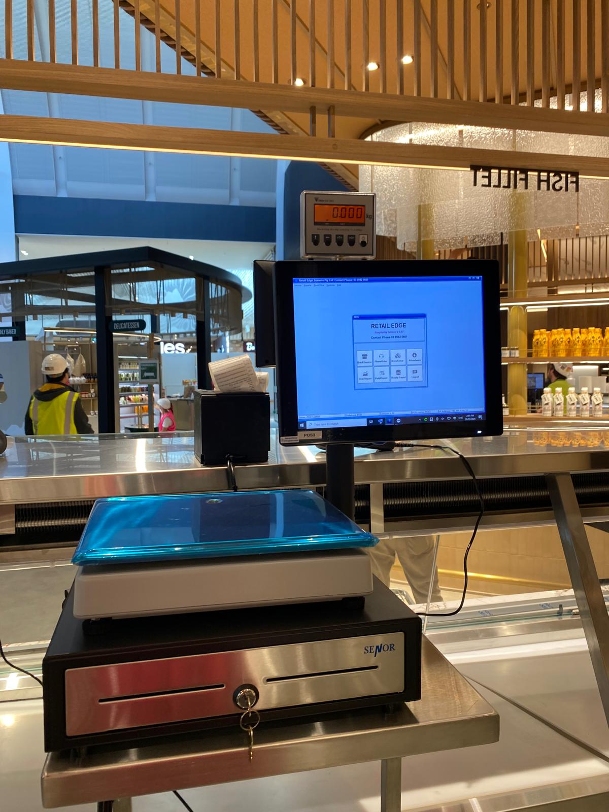 Fish shop counter setup with POS